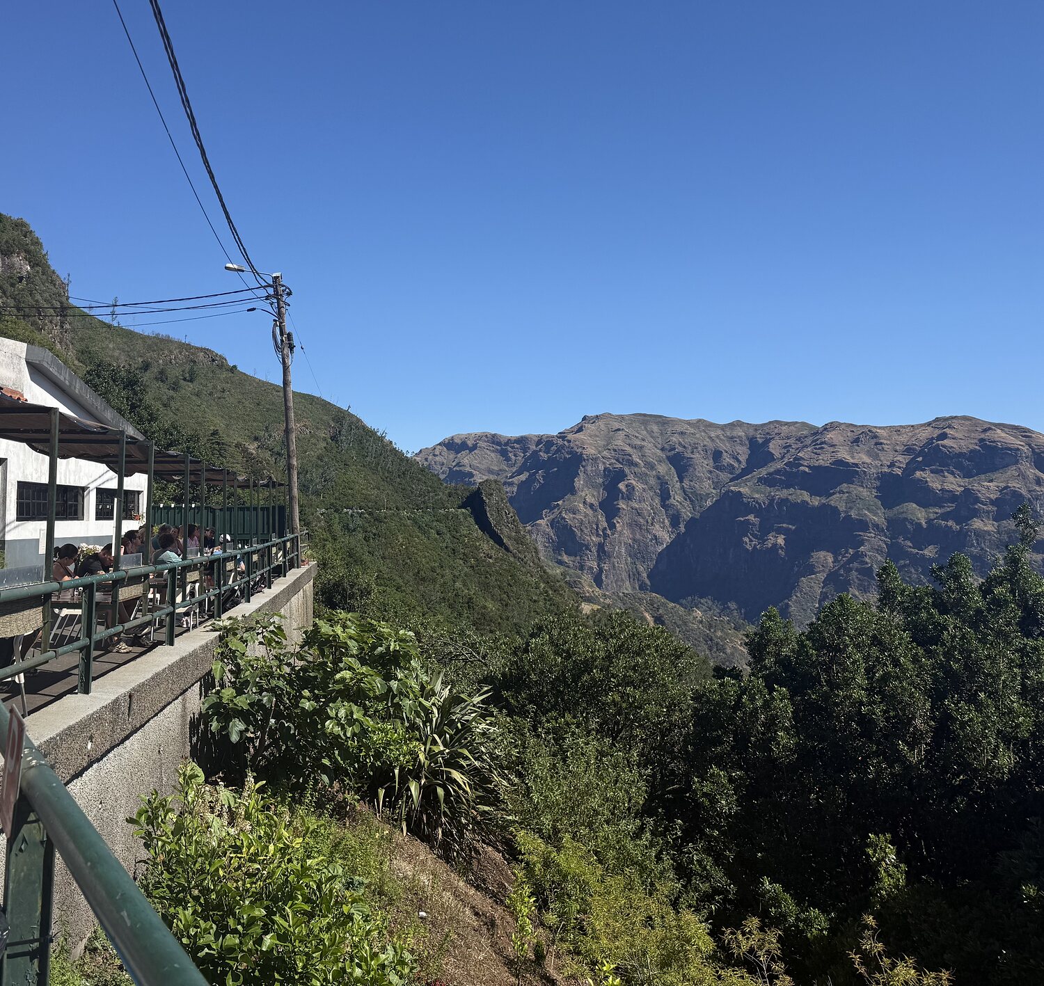 View along the terrace railing towards the mountains